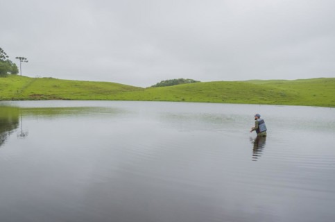 Black bass fisherman fishing with flyfishing, Cambara do sul, Rio Grande do sul, Brazil, South