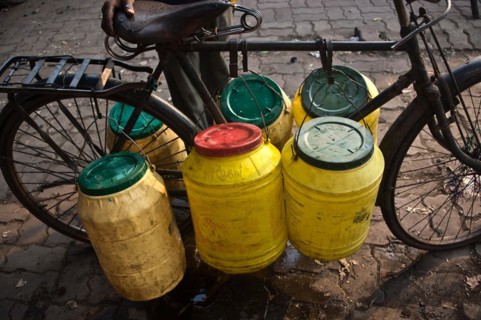 Plastic barrels, water, draw, public water pump, Jharkhand, India, Asia