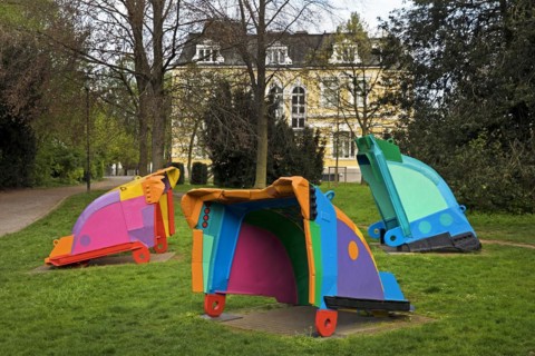Painted excavator shovels in the municipal park in front of Villa Erckens, artist Guenther Cremers,