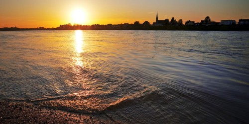 Sunset over the Rhine in Neuss with a view of Volmerswerth in Duesseldorf, Lower Rhine, North