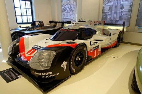 PORSCHE 919 HYBRID LMP1 MOCK-UP, side view of a Porsche Hybrid racing car in a showroom, AUTOMUSEUM