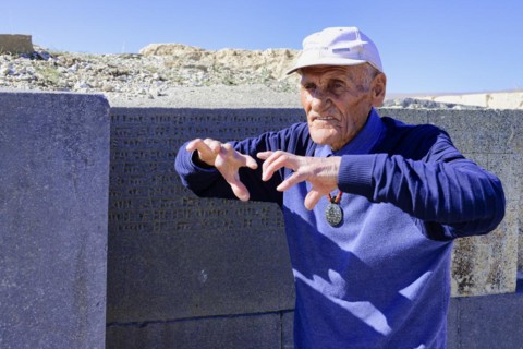 Ruins of the Urartian citadel of Cavustepe, Wardian explaining the cuneiform writing, Van, Turkey,