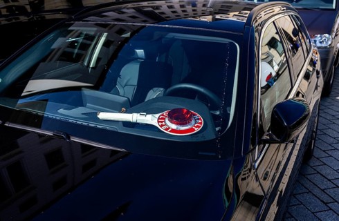 Parked police vehicle with red stop stick behind the windscreen, Berlin, Germany, Europe