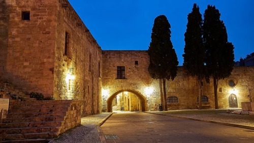Old stone house in a quiet place, illuminated by street lamps at dusk, night shot, Rhodes Old Town,