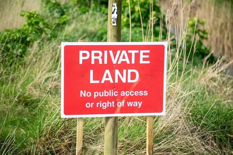 Private Land No public access or right of way sign, in countryside, Alderton, Suffolk, England, UK