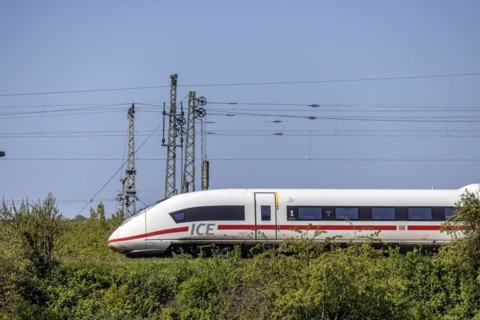 Deutsche Bahn AG InterCityExpress ICE en route, railway embankment and overhead lines,