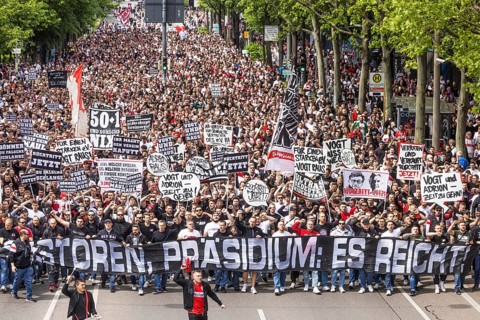 Protest march in front of the southern summit. Around 10, 000 VfB fans march to the stadium in