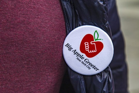 Plaque of the Big Apple Greeter. The Big Apple Greeters are a voluntary organisation. They show