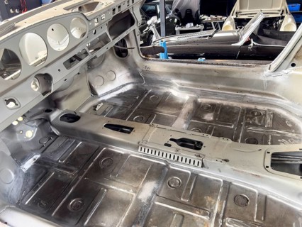 Gutted restored freshly galvanised partially galvanised passenger compartment empty interior of