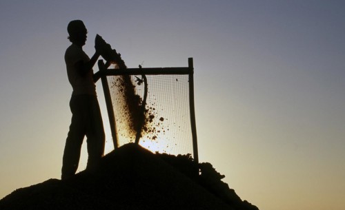 Sand sieving, Rajasthan, India. Sand, construction material, Thar desert. man, low caste, caste