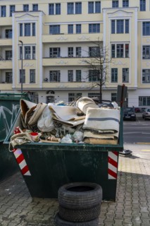 Container with building material at the roadside, Berlin, Germany, Europe
