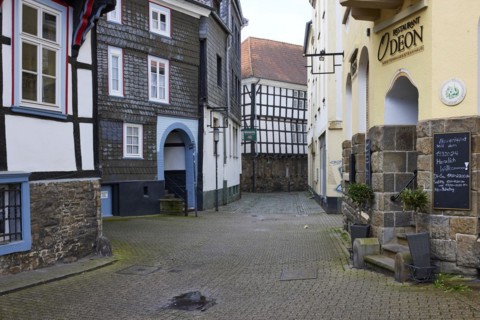 Entrance to the church square, Odeon restaurant and the rear of the historic town hall in