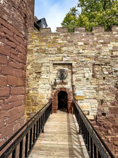 View over a fortified bridge to a small, narrow castle courtyard of the 13th century Trendelburg