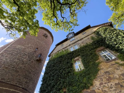 Steep view from castle courtyard upwards to left tower castle tower Rapunzel tower of Trendelburg