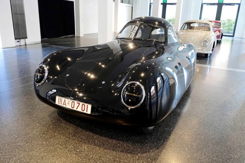 1939 PORSCHE TYP 64 VW TYP 60, A black Porsche sports car exhibited in a bright hall, AUTOMUSEUM