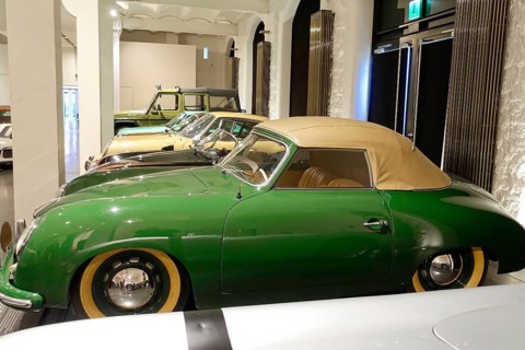 A green classic Porsche Cabriolet in an automobile exhibition, AUTOMUSEUM PROTOTYP, Hamburg,