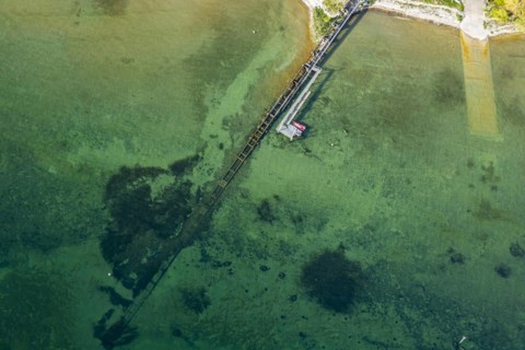 Flight in a zeppelin along the shore of Lake Constance, aerial view, shore area with turquoise