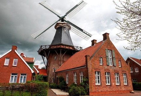 Historic mill and miller's house in the fishing village of Ditzum, municipality of Jemgum, district