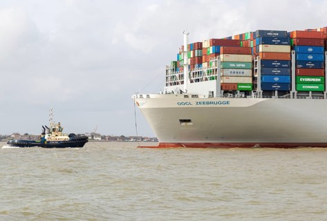 OOCL Zeebrugge container ship leaving quayside departing from Port of Felixstowe, Suffolk, England,