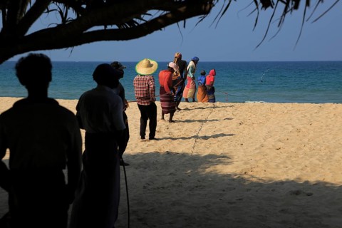 Traditional fishing hauling nets Nilavelli beach, near Trincomalee, Eastern province, Sri Lanka,