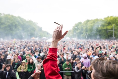 Participants smoke a joint at 16:20 (4:20 pm) at the 420 legalisation party at the Brandenburg