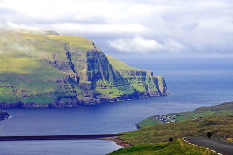 View over high mountains, cliffs and a mountain road, Eidi, Tjornuvik, Faroe Islands, Denmark,