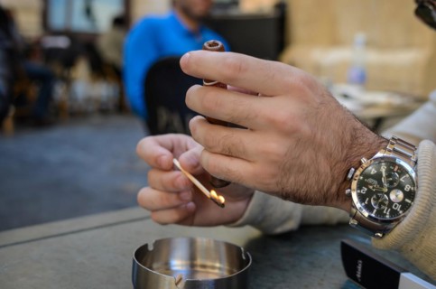 Beirut, Lebanon, April 04, 2017: lighting cigar in street bar in downton beirut, Asia