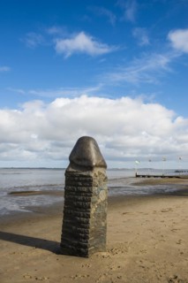 Stone sculpture on the beach and Wadden Sea, penis, artist Eckart Grenzer, Dangast, Jade Bay, North