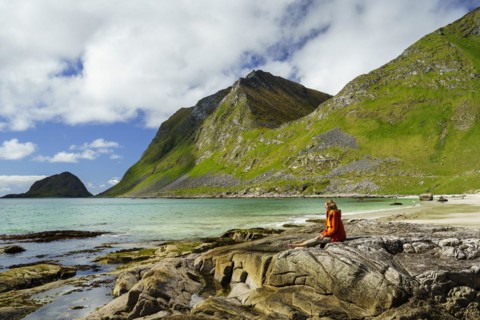 Landscape with sea at the sandy beach of Haukland (Hauklandstranda) with the mountain Veggen. A