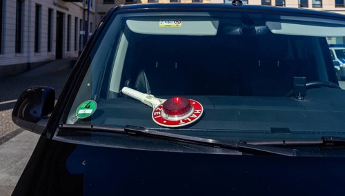 Parked police vehicle with red stop stick behind the windscreen, Berlin, Germany, Europe