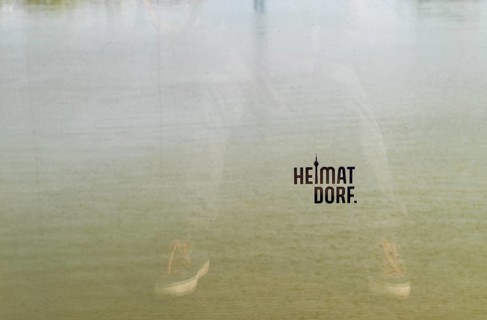 Heimatdorf, inscription on glass balustrade on the harbour bridge Living Bridge m Medienhafen