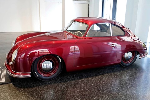 Side view of a red Porsche 356 Coupe in an exhibition hall, AUTOMUSEUM PROTOTYP, Hamburg, Hanseatic