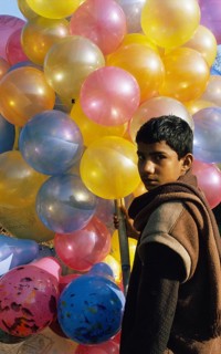 Boy selling balloons, Pakistan, Asia