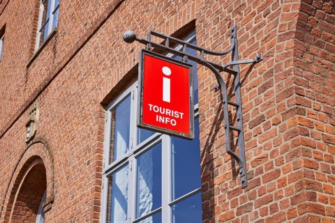 Nose sign tourist information centre at the old town hall in Husum, Nordfriesland district,