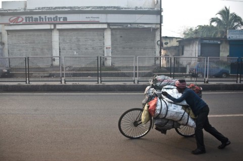 Man, carrying on bike, street, coal, selling to urban dwellers, restaurants, shops, Dhanbad, Bihar,