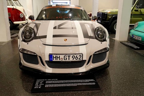 White Porsche 911 GT3 RS, Porsche sports car with distinctive GT stripes in an automobile