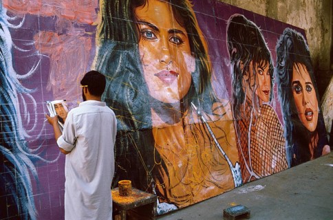Christian man painting cinema posters, Pakistan, Asia
