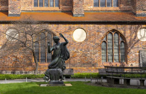 Klio statue in front of the side wing of the Nikolaikirche, Nikolaikirchplatz, Berlin, Germany,
