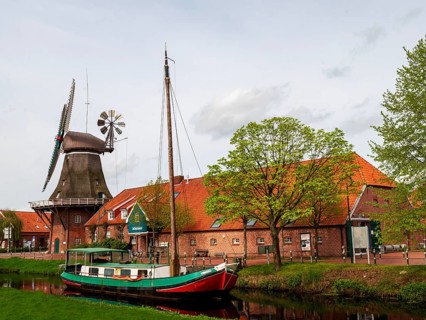 Historic windmill, gallery hollaender, traditional ship Mariechen, on the Grossefehn Canal,