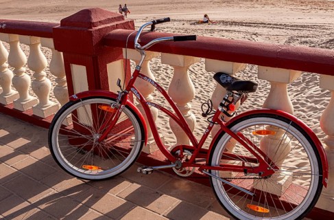 Red ladies' bicycle, balustrade on the beach of Bornos, Andalusia, Spain, Europe