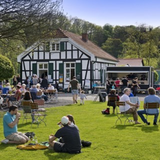 People at the Royal Lockkeeper's House on the Ruhr on the Ruhr Valley cycle path, Witten, North