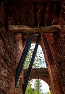 Protestant Reformed Church in Midlum, leaning bell tower, struts inside, municipality of Jemgum,