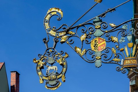 Wrought iron nose shield from 1632 with coat of arms and lamb, Kaufbeuern, Allgaeu, Swabia,