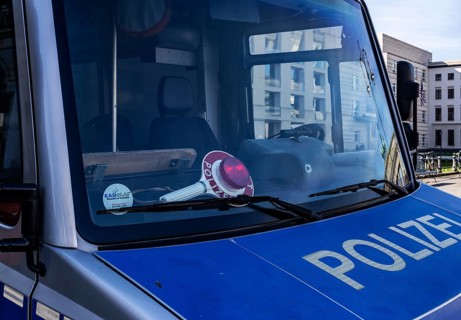 Parked police vehicle with red stop stick behind the windscreen, Berlin, Germany, Europe