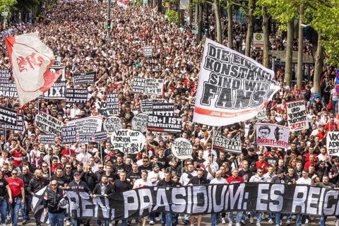 Protest march in front of the southern summit. Around 10, 000 VfB fans march to the stadium in
