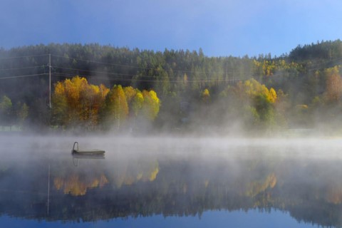 Autumn morning mist over a calm lake, foliage colouring, Bullaren, Bohuslaen. Sweden