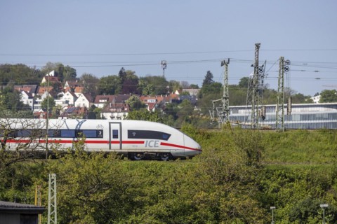 Deutsche Bahn AG InterCityExpress ICE en route, railway embankment and overhead lines,