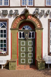 Entrance door of the Swan pharmacy in the city centre of Husum, district of Nordfriesland,