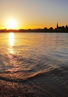 Sunset over the Rhine in Neuss with a view of Volmerswerth in Duesseldorf, Lower Rhine, North