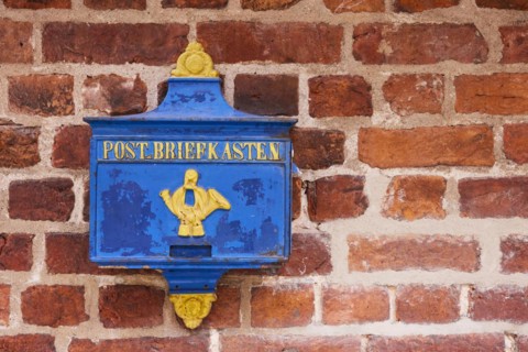 Old blue post box on a brick facade in Boettcherstrasse in Bremen, Hanseatic city, state of Bremen,